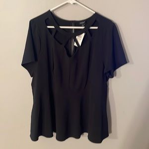 Black blouse with geometric cutouts